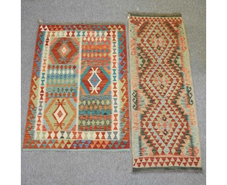 A kelim runner, 183 x 67cm, together with a kelim rug, 152 x 102cm (2)
