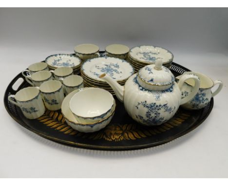 An early 20th Century Royal Worcester blue and white part tea/coffee service on an early to mid 20th Century black painted me