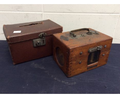  An oak early 20th Century pigeon clock in carry case by "Jundes-Thexor timing clock by Hudsons Ltd".