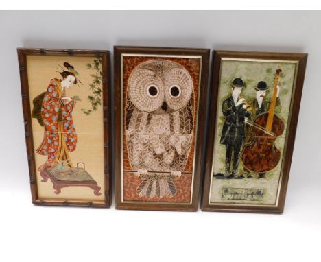 Three 20th century Maw &amp; Co ceramic tiles, "Street Musicians", an Owl and a Geisha Girl, all wooden framed. (3)