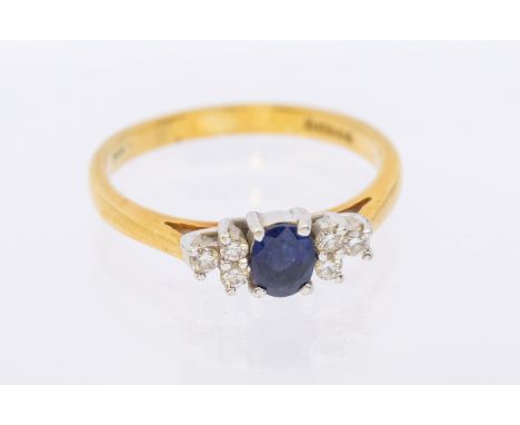 A sapphire and diamond set 18ct gold clasp, comprising a claw set oval mixed cut sapphire, approx 4x3mm, three round brillian
