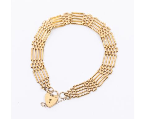 A 9ct gold gate bracelet, width approx 9mm, padlock clasp, length approx 18cm, weight approx 6gms    Further details:links in