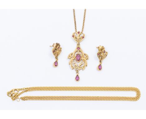 A ruby and 9ct gold drop pendant, set to the centre with a mixed cut oval ruby, suspending a pear cut ruby dropper, the bale 