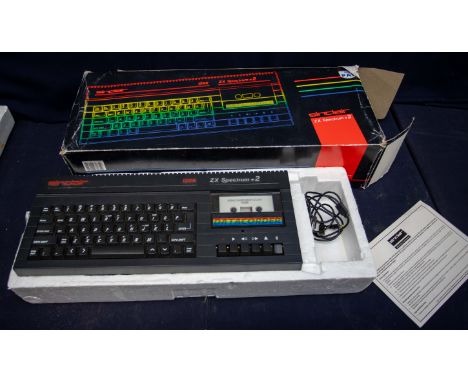 A boxed Sinclair, two Spectrum +2 keyboard data recorder.
