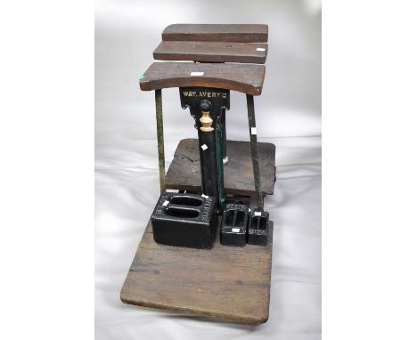 Ornate W &amp; T Avery floor standing oak and cast iron weighing scales, with weights, in very good condition, 79cm H.