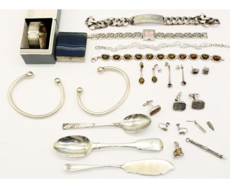 A collection of silver jewellery including an amber bracelet and earrings, together with two torque bangles, cufflinks, gents