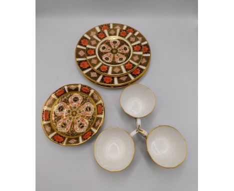 A group of Royal Crown Derby items in the 1128 pattern , to include 3 side plates approx 21cm diameter , 3 tea plates approx 