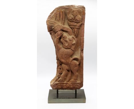 A carved pink sandstone architectural doorway framing fragment depicting a Guardian Lion, probably Cambodia, Bantay Srei Peri