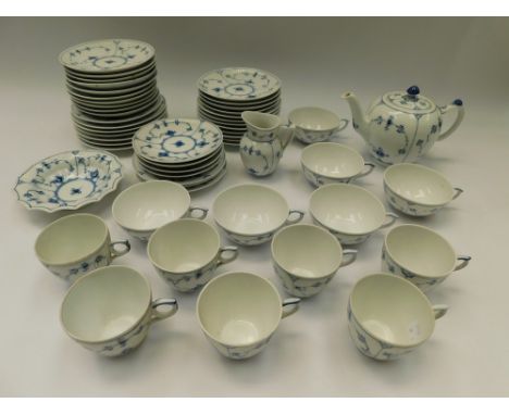 Royal Copenhagen: a part tea service in blue and white 'onion' design, to include teapot, milk jug, cups, saucers, dish and p