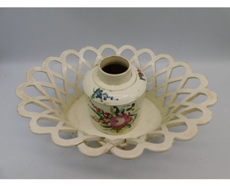 An 18th Century Leeds Creamware tea caddy with hand painted floral detail along with a Creamware pierced fruit bowl/basket. b
