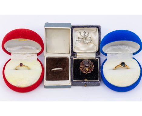 A collection of rings to include a ruby and 18ct gold solitaire, set with a round mixed cut stone approx 4mm, size M, an oval