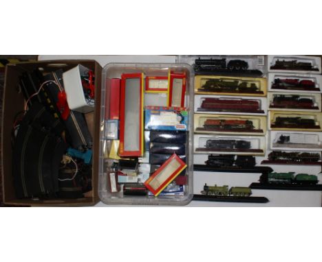  A collection of assorted models of locomotives upon stands; together with a collection of empty model railway boxes includin
