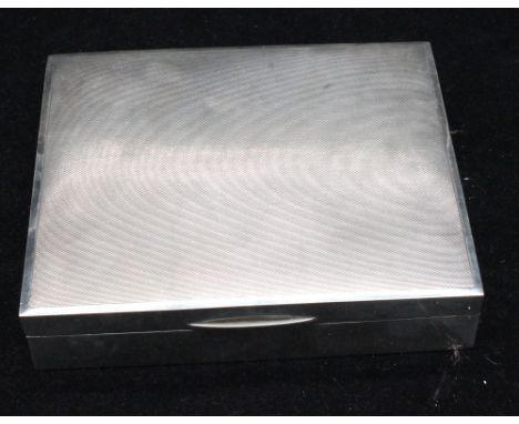 An Elizabeth II silver rectangular cigarette box, engine turned decoration, cedarwood interior and leather based, hallmarked 