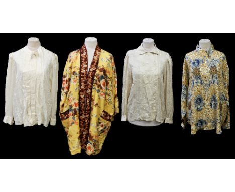 A collection of blouses to include a Werner Graumann Pret A Porter cream herringbone blouse, Argenti silk cream tie neck blou