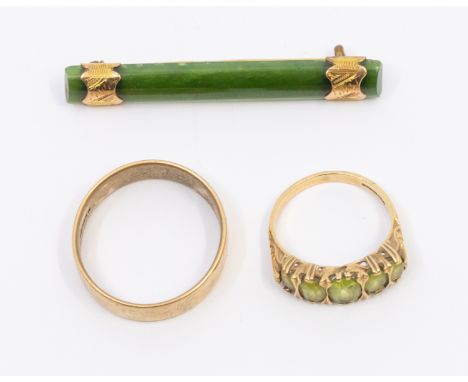 A peridot and 9ct gold five stone ring, width approx 7mm, size N, total gross weight approx 3.2gms, a 9ct gold wide wedding b