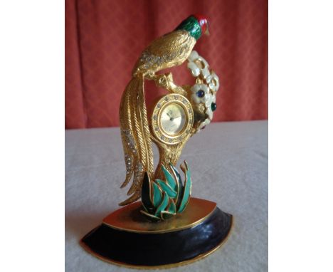 A 20th cent decorative metal mantle clock , decorated with enamel , with small glass gems, some enamel missing,&nbsp;