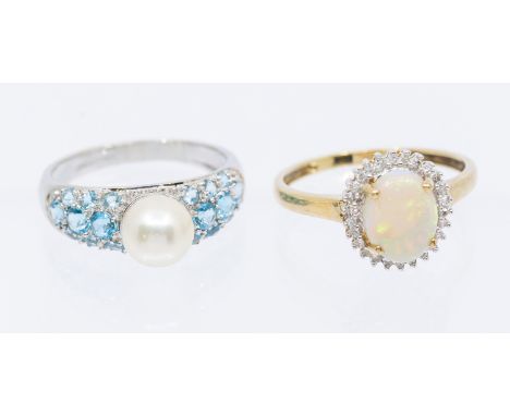 Two stone set gold rings including an opal and diamond set 9ct gold cluster ring, set with oval opal within a diamond set bor