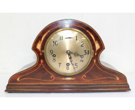 An Edwardian mahogany 8 day with Westminster chime mantle clock with box wood and mother of pearl inlay, Arabic numerals.