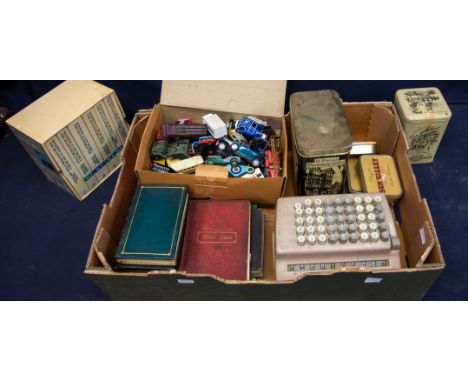 A mixed lot to include; die cast cars and vehicles, vintage to modern empty tins, a Plus mathematic calculator untested, Wins