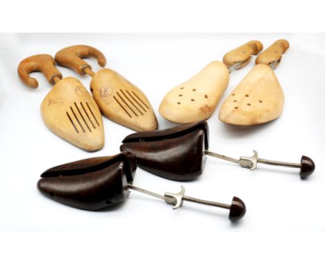 A pair of early to mid 20th century bakelite and metal shoe trees, approx. 30.5cm long each, and two pairs of light wooden sh