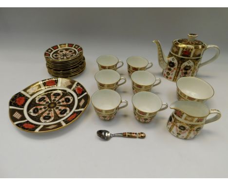 A Royal Crown Derby Imari 1128 tea service for a six-place setting, including teapot, milk jug, sugar basin, spoon (A/F), six