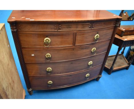 A 19th Century mahogany bow fronted Scotch style chest of two over three drawers, with large brass ring handles , width conce