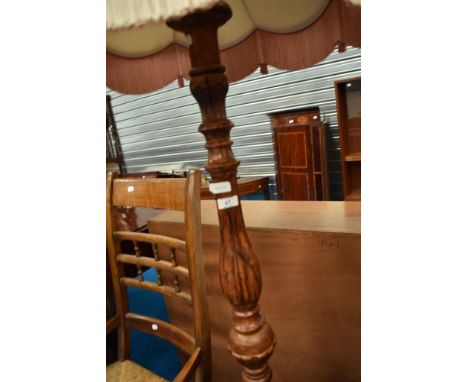 A traditional stained frame standard lamp
