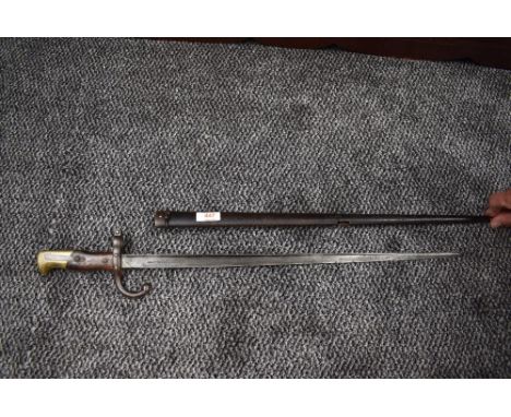 A French Epee Bayonet model 1874 for use with the Gras Rifle, Chassepot conversion, blade dated 1874 with metal scabbard havi