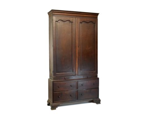 George III oak linen press, the upper stage with moulded cornice and arch-panelled doors enclosing four adjustable shelves ov