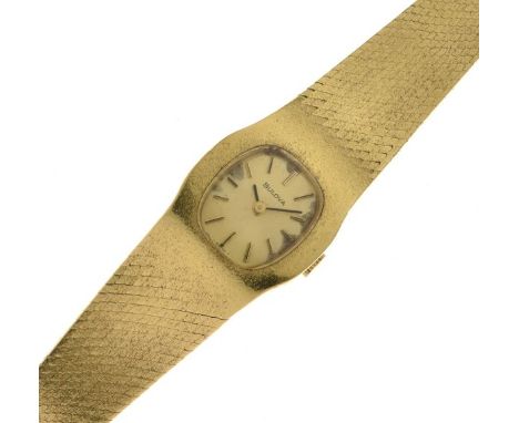 Bulova - Lady's 18ct gold manual bracelet watch, the gilt dial with gilt black batons and black hands, the integral Milanese 