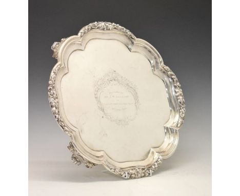 Paul Storr silver salver, the piecrust rim with acorn and oak leaf decoration, standing on four scallop and scroll feet, late