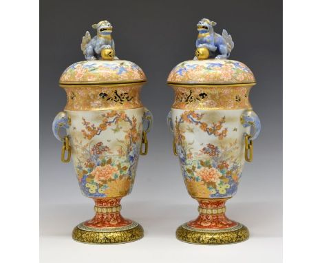Pair of Fukagawa vases and covers, Meiji period, each domed cover with a Fo Dog finial, pierced gilt foliate rims, elephant h