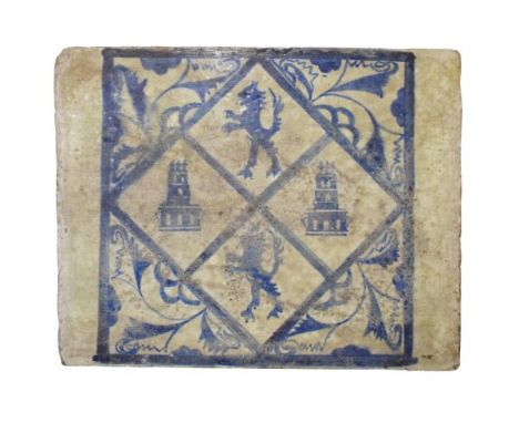 Large Spanish blue and white painted tile, decorated with lion rampant and towers, probably 15th/16th Century, 35cm x 44cm   