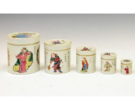 Set of five Chinese Famille Rose cylindrical containers and covers, each decorated with figures and calligraphy, 4cm - 11.5cm