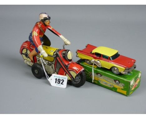 A French tinplate friction action motorcycle and rider, marked 'S F A Paris, Made in France', 17 cms long and a mint and boxe