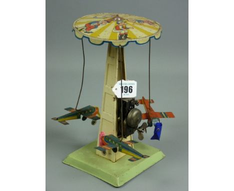 A vintage Continental chairoplane carousel, delightful clockwork toy with dinging bell action, three litho decorated aircraft