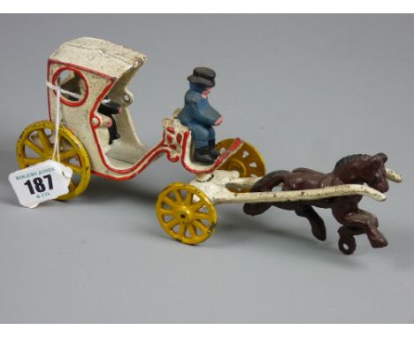 A vintage cast iron model of a horse drawn hackney carriage, brightly painted, probably European, 24 cms long