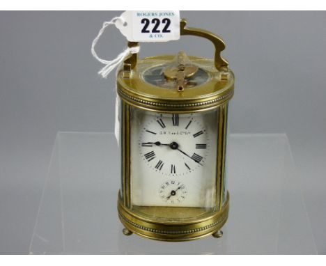 A late 19th/early 20th Century French brass and bevelled glass cylindrical cased carriage clock retailed by G H Lee &amp; Co 