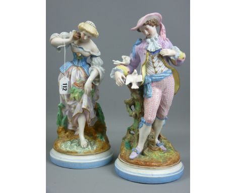 Pair of Victorian bisque porcelain figures in classically styled decorated clothing of a young woman with seashells and a you