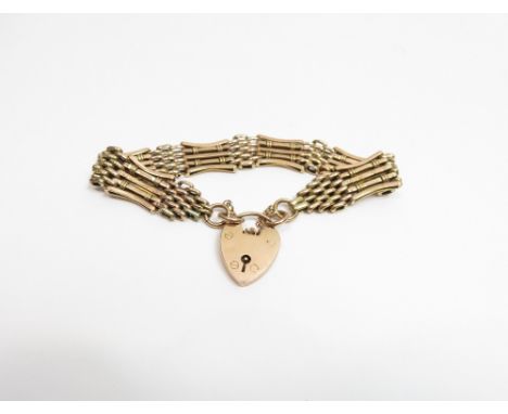 A bracelet, of fancy five bar gate link, stamped '9ct', 16 g gross