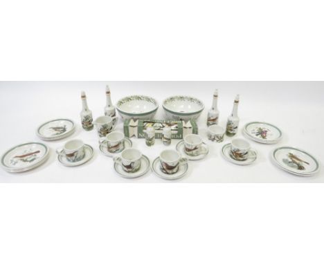 A quantity of Portmeirion Birds of Britain pattern pottery, includes storage jars, cups and saucers, cream jugs, some items i