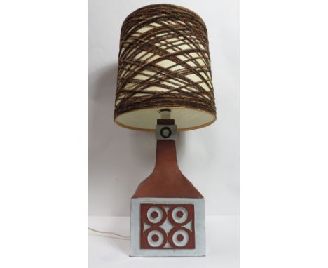 A circa 1970's table lamp with moulded pottery base and original shade, base 37.5cm high