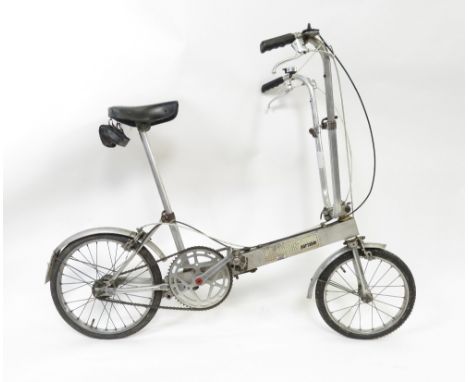 A vintage Bickerton folding bicycle fitted with three speeds and bell, original labels to frame