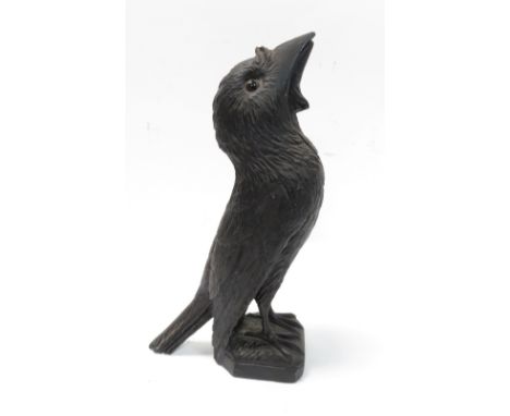 A Black Forest carved wooden nutcracker in the form of a bird having inset glass eyes, 22.5cm high