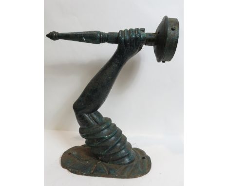 A heavy metal wall bracket modelled as an arm holding a torch, 40cm high