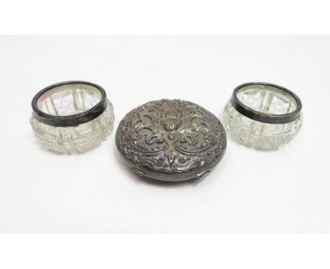 A continental embossed powder compact, stamped 'PE', over '800', over 'Deluxe', 7.3 cm diameter; with a pair of glass salts w