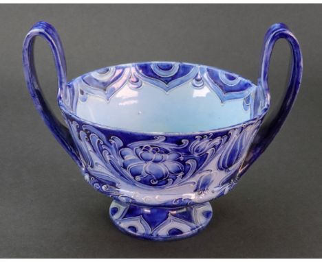 A Moorcroft Florian Ware two handled bowl, on a pedestal foot, M. 1567, Rd No. 360575, 13.5cm high x 17.5cm wide.Illustrated.