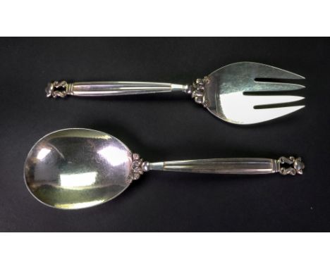 Georg Jensen; a pair of Danish acorn pattern serving spoon and fork, detailed sterling Denmark, 24cm long, 7ozs.Illustrated