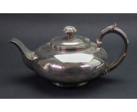 A George IV silver compressed circular teapot, London 1825, makers mark M S, with threaded rim, scroll handle and foot, the h