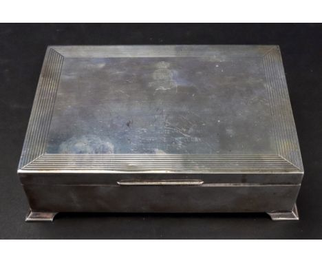 An Art Deco style silver cigar box, Hardy Brothers, Birmingham 1965, the hinged cover with thread border and inscribed 'To Br